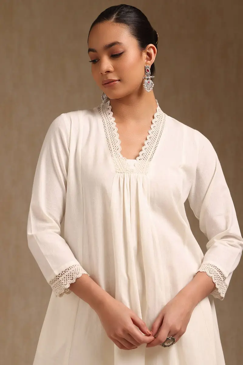 Off White Cotton Solid V-Neck Lace Inserts A-Line Kurta With Front Pleats